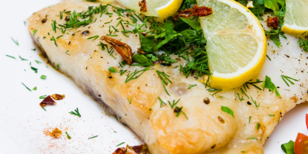 Receta de merluza al horno con patatas y limón
